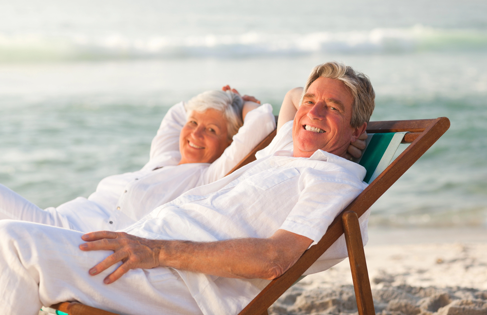 retiree couple on beach